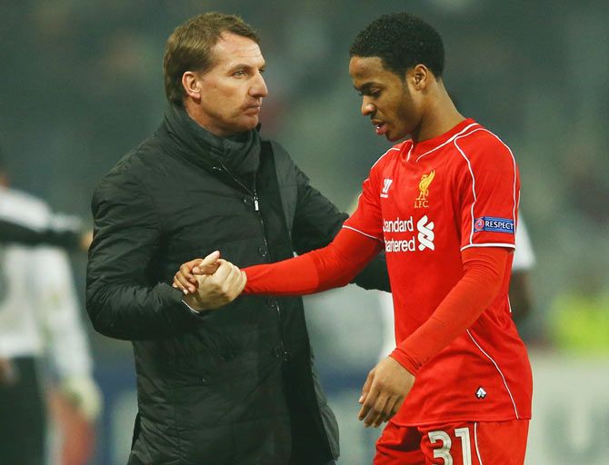      Liverpool manager Brendan Rodgers with Raheem Sterling