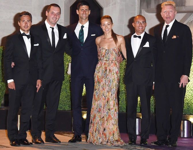 Novak Djokovic (4th from left), wife Jelena Ristic, Boris Becker (right) and guests attend the Wimbledon Champions Dinner at The Guildhall