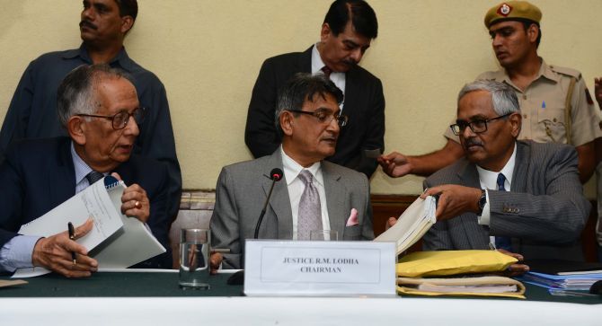 Justice RM Lodha (centre) signs the verdict in the Indian Premier League spot-fixing probe in July 2015