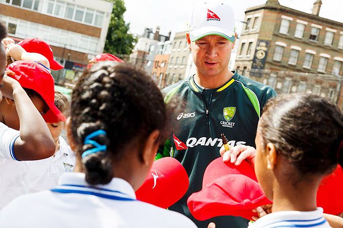 Australia's Michael Clarke meets school children at St Edwards RC Primary School, Westminster as the Australian Cricket Captain and Qantas Ambassador shares his inside tips at a coaching clinic for England's future cricket stars in London on Wednesday