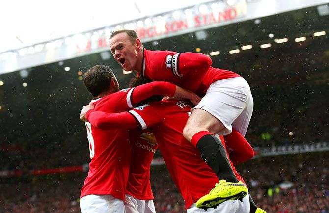 Manchester United players celebrate a goal during their Premier League match against Manchester City