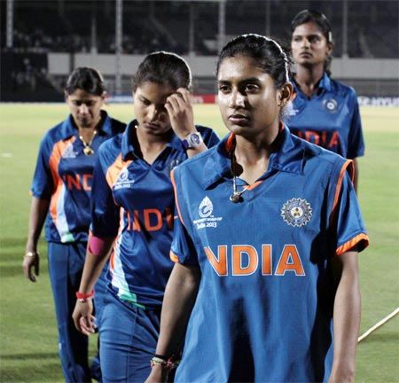 Mithali leads her team out of the field