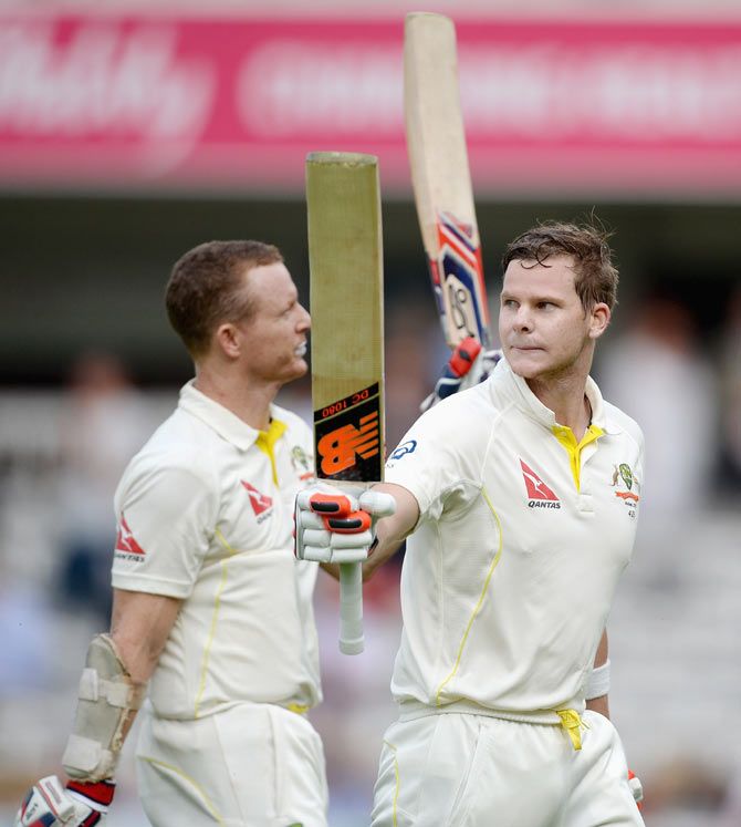 Australian unbeaten batsmen Chris Rogers and Steven Smith leave the field at the end of play on Thursday