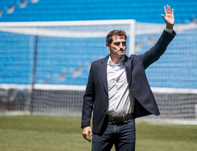 Departing Real Madrid captain and goalkeeper Iker Casillas waves to supporters at an official send-off at the Bernabeu stadium in Madrid on Monday