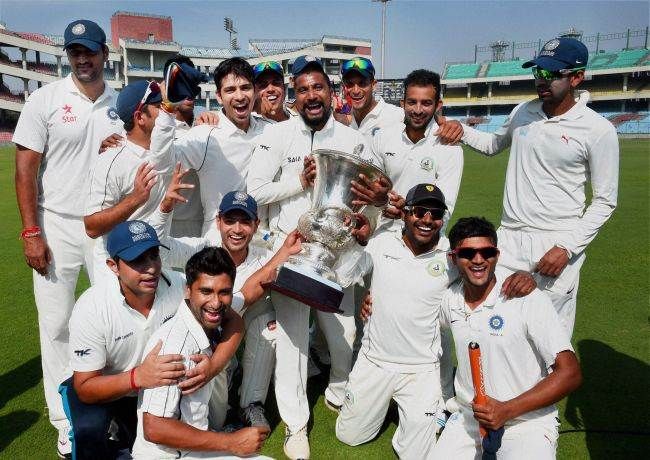 The Central Zone team, led by Piyush Chawla, celebrates with the Duleep Trophy after beating South Zone in the final of the tournament in 2014