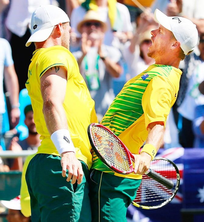 Australia’s Lleyton Hewitt and Sam Groth do the chest-bump as they celebrate winning their doubles at the Davis Cup World Group quarter-final against Kazakhstan on Friday, Friday 17