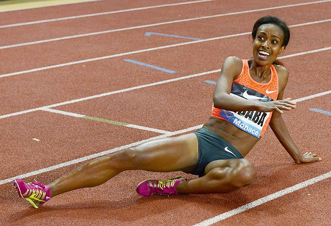Ethiopia's Genzebe Dibaba celebrates her victory and a new world record in the 1500 meters women event at the IAAF Diamond League Herculis meeting at the Louis II Stadium in Monaco, on Friday, July 17