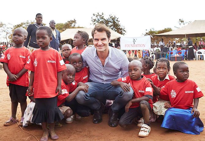 Roger Federer with the children in a village in Malawi