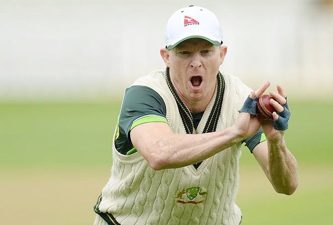Australia's Chris Rogers catches a ball during a training session