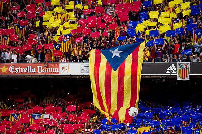 A pro-independence of Catalonia flag is shown by supporters of FC Barcelona as Spanish National Anthem is played before the Copa del Rey King's Cup Final between Athletic Club and FC Barcelona at Camp Nou in Barcelona on May 30