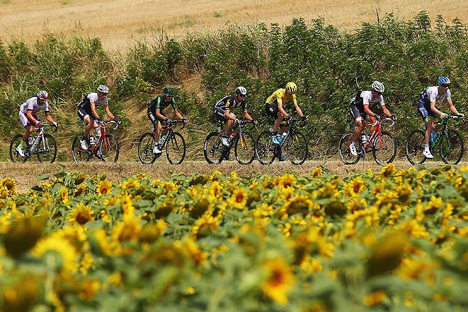 A peleton rides during Stage 13, a 198.5 km stage between Muret and Rodez, in Rodez, France, on July 17