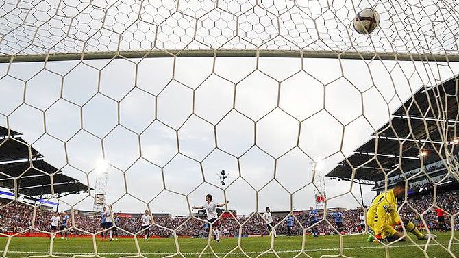 Tottenham Hotspur goalkeeper Michel Vorm (13) dives too late as MLS All Stars midfielder Kaka (22) of Orlando City SC shoots to score during the first half of the 2015 MLS All Star Game at Dick's Sporting Goods Park in Denver Colorado on Wednesday