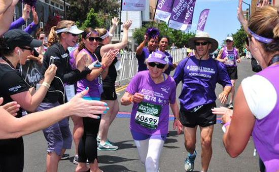 Harriete Thomson crosses the finish line amidst cheers as she completes the San Diego marathon on Sunday