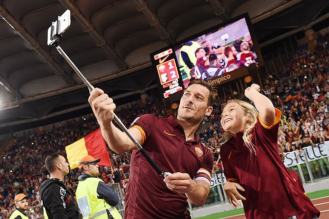 AS Roma's Francesco Totti takes a selfie after their Serie A match against US Citta di Palermo at Stadio Olimpico in Rome on Sunday