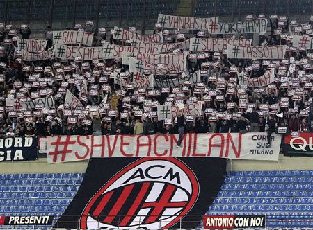 Fans show their support for AC Milan during a Serie A match