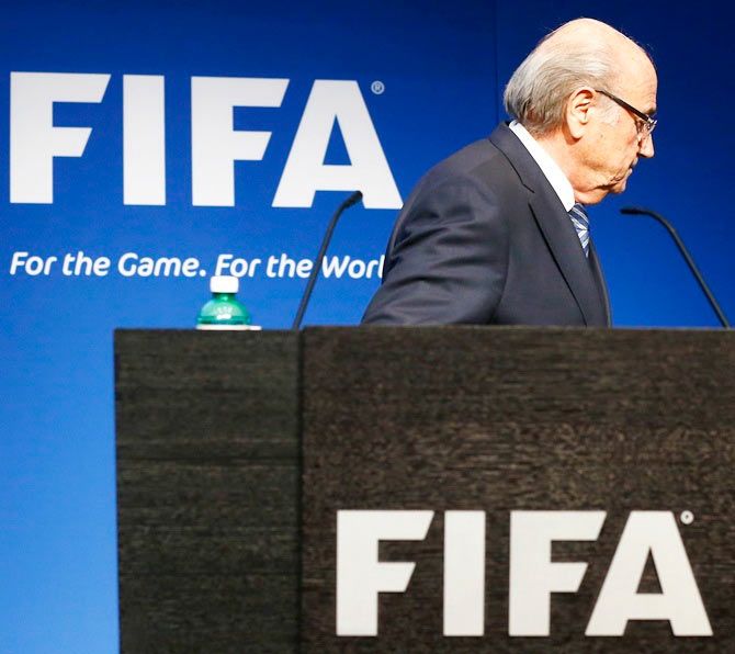 Sepp Blatter leaves after his statement during a news conference at the FIFA headquarters in Zurich