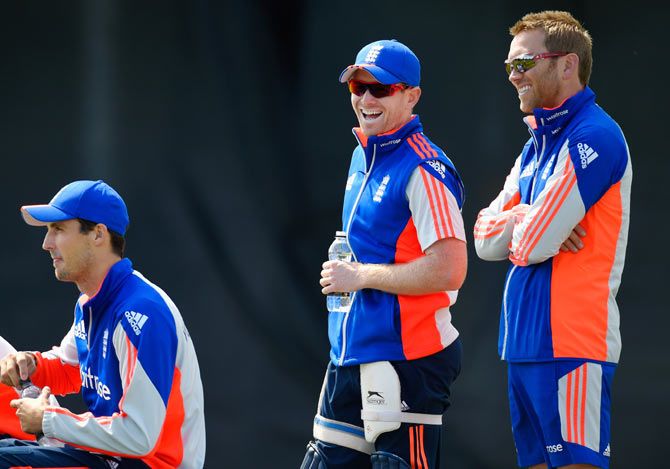 England captain Eoin Morgan (centre) shares a joke with teammates during the team's nets session