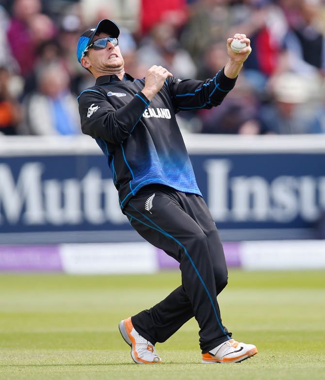 New Zealand bowler Matt Henry takes the catch to dismiss England batsman Alex Hales