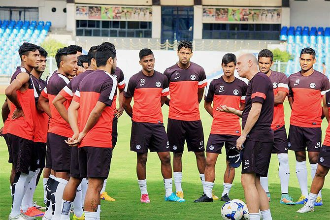 Indian football team coach Stephen Constantine speaks with his wards at the at the Kanteerava Stadium in Bengaluru on Tuesday