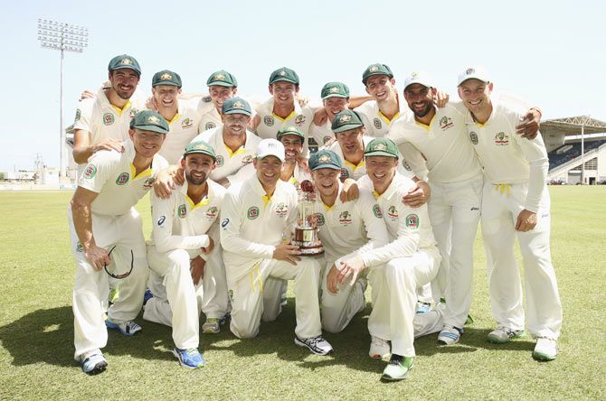 Australia players celebrate with the Frank Worrell Trophy after defeating West Indies on Day 4 of the 2nd Test at Sabina Park in Kingston, Jamaica, on Sunday