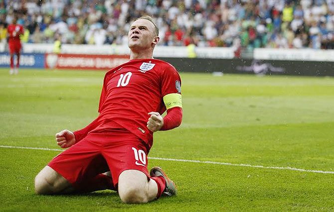 ngland's Wayne Rooney celebrates after scoring their third goal against Slovenia in their Euro qualifiers on Sunday