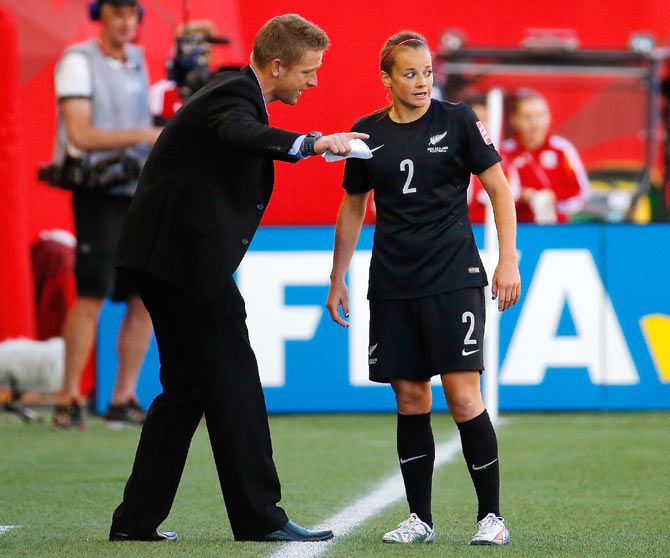 New Zealand coach Tony Readings gives instructions to Ria Percival during their match against China