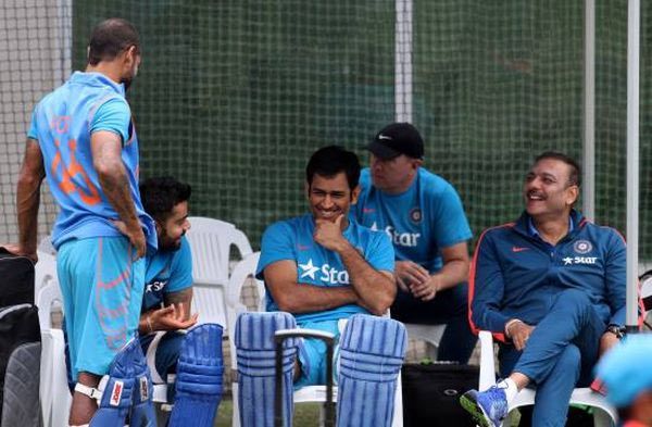 Virat Kohli jokes during a practice session as Mahendra Singh Dhoni, Shikhar Dhawan and Ravi Shastri look on