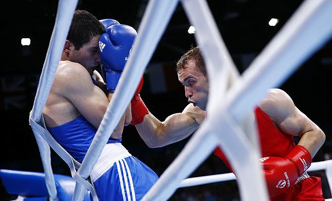 Azerbaijan's Parviz Baghirov (left) and Russia's Alexander Besputin fight during their men's 69kg Welter weight boxing gold medal fight at the 1st European Games in Baku, Azerbaijan, on June 27