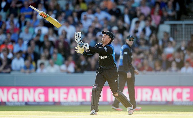 New Zealand's Luke Ronchi throws a bat during the NatWest International T20 against England at Old Trafford on June 23