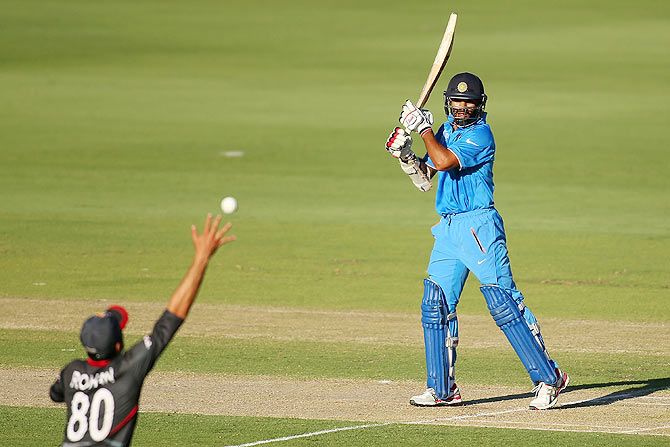 Rohan Mustafa of the UAE takes a catch to dismiss Shikhar Dhawan of India during their match at WACA in Perth on February 28