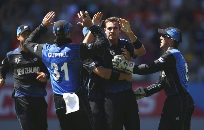 Tim Southee of New Zealand celebrates with teammates after taking a wicket