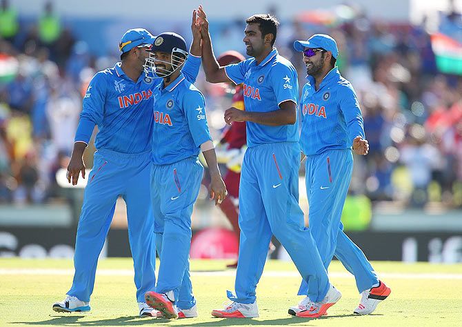 India's Ravichandran Ashwin celebrates with teammates after taking the wicket 