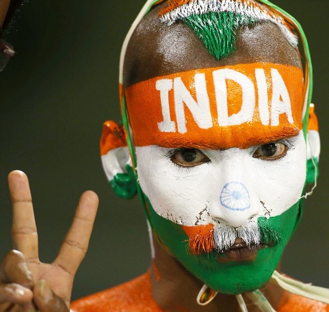 An Indian fan shows his support