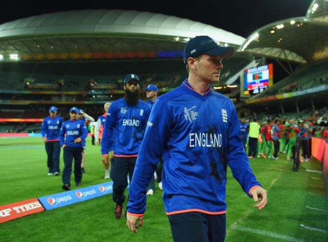 England captain Eoin Morgan leads his team out of the field
