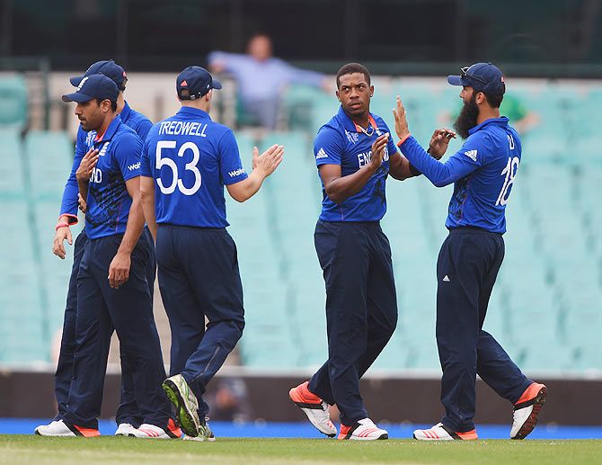 England's Chris Jordan celebrates with teammates after claiming a wicket