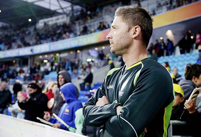 Australia's Michael Clarke waits for play to restart against Scotland during a rain delay in their Cricket World Cup match at the Bellerive Oval in Hobart on Saturday