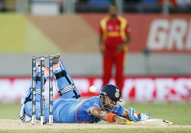 India's Suresh Raina dives in to make his crease in a match against Zimbabwe