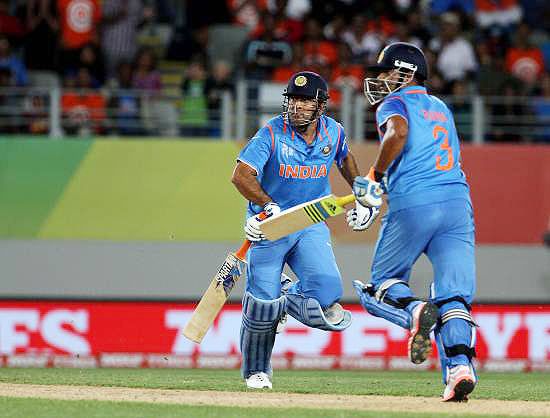 Indian captain Mahendra Singh Dhoni and teammate Suresh Raina steal a run