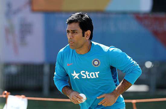 Mahendra Singh Dhoni bowls during a nets session