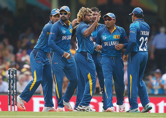 Lasith Malinga of Sri Lanka celebrates with his teammates after claiming a wicket