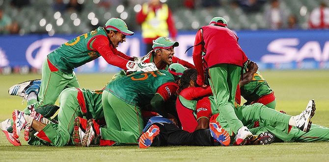 Bangladesh's cricket team celebrates after they knocked England out of the 2015 ICC World Cup match in Adelaide, ON March 9