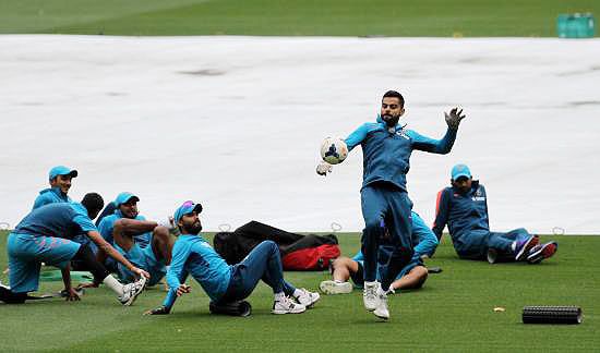 India's Virat Kohli plays football during a practice session at the Melbourne Cricket Stadium on Tuesday