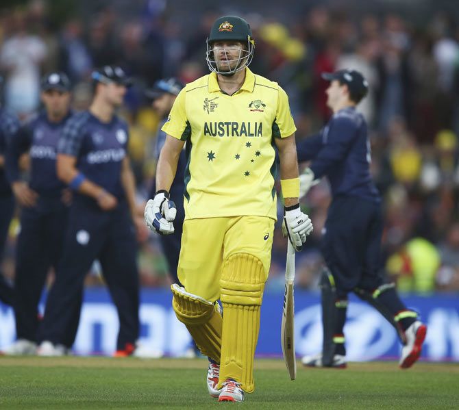 Shane Watson of Australia walks from the ground after being dismissed by Josh Davey of Scotland