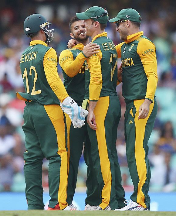 JP Duminy of South Africa celebrates with his teammates after taking the wicket of Tharindu Kaushal of Sri Lanka to claim a hat trick on Wednesday