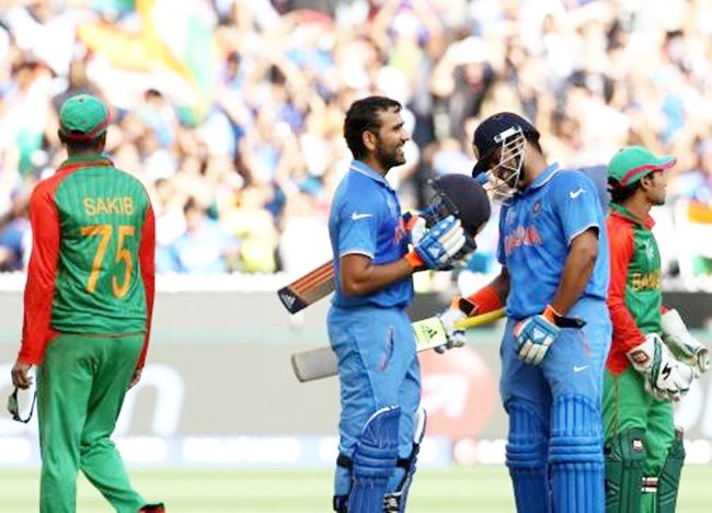 India's Rohit Sharma and Suresh Raina during the World Cup quarter-final against Bangladesh at the MCG