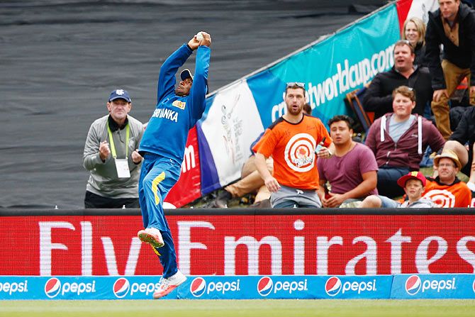 Jeevan Mendis of Sri Lanka goes full stretch to complete a fabulous catch and dismiss Brendon McCullum of New Zealand