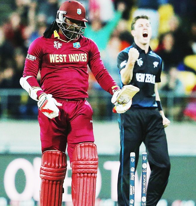 Adam Milne of New Zealand celebrates after bowling Chris Gayle of West Indies out