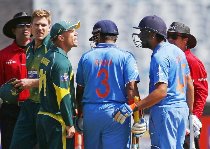 Australia's David Warner argues with India's Rohit Sharma 