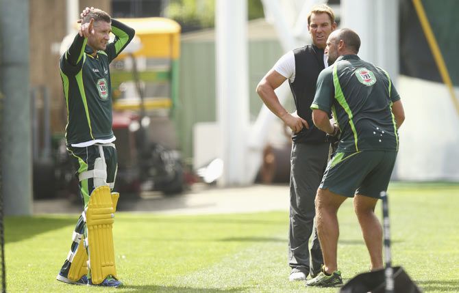 Australia captain Michael Clarke is engrossed in discussion with Shane Warne and batting coach Michael Di Venuto during a nets session at Sydney Cricket Ground on Wednesday