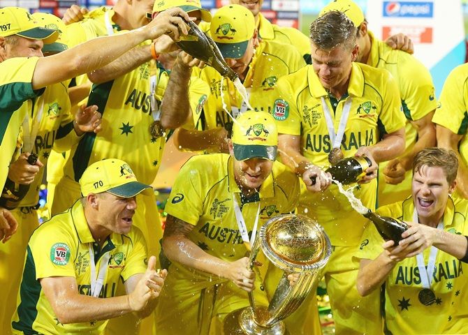 Michael Clarke of Australia is sprayed with champagne